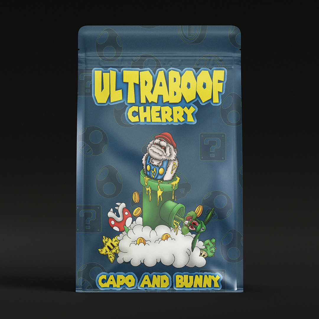 "ULTRABOOF CHERRY" product pouch with Capo and Bunny illustration on a green pipe, translucent blue packaging.